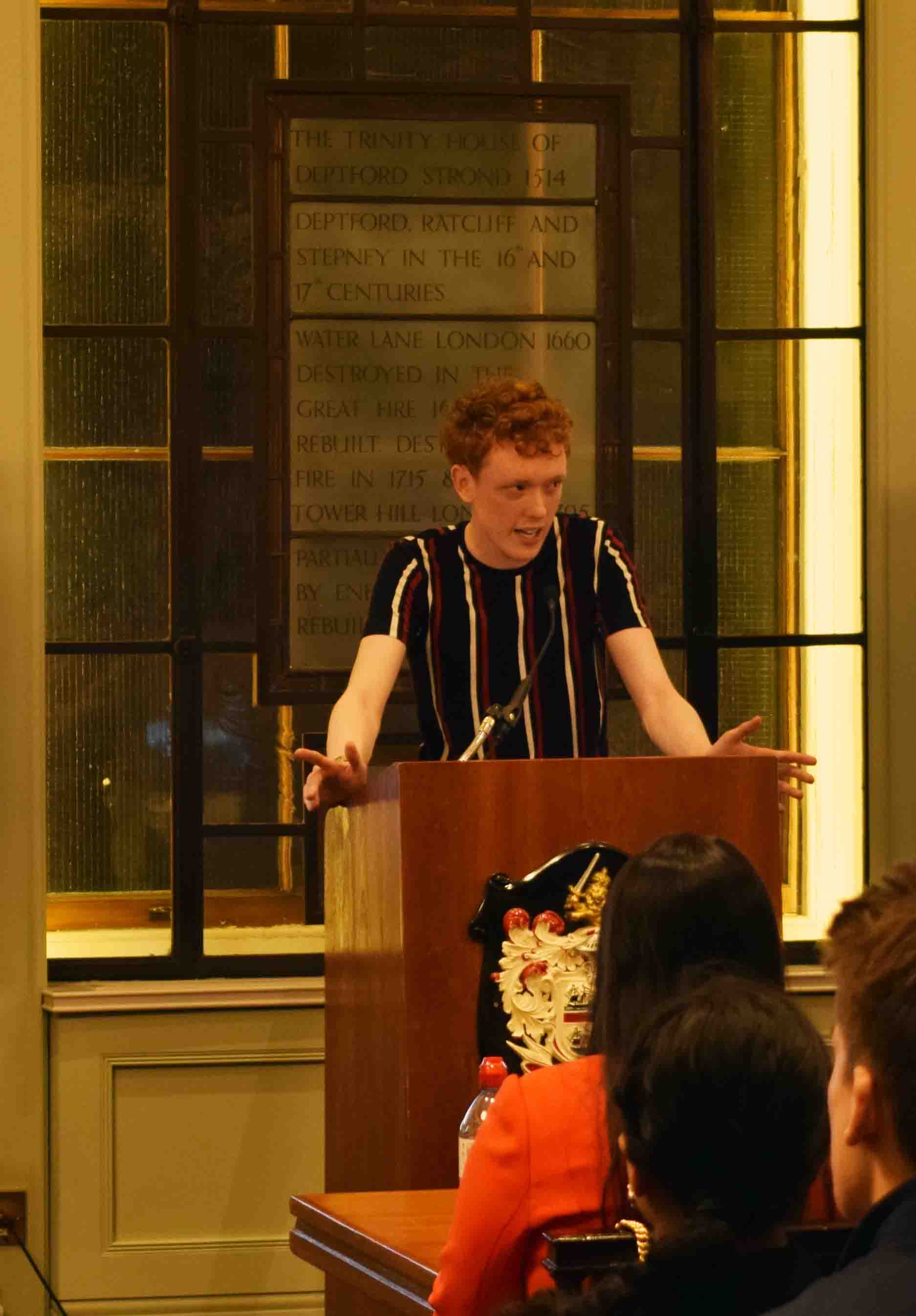 Joseph putting his public speaking skills to use at a university debate