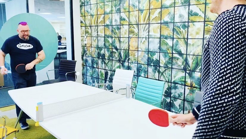 Rhymes playing ping pong in the office